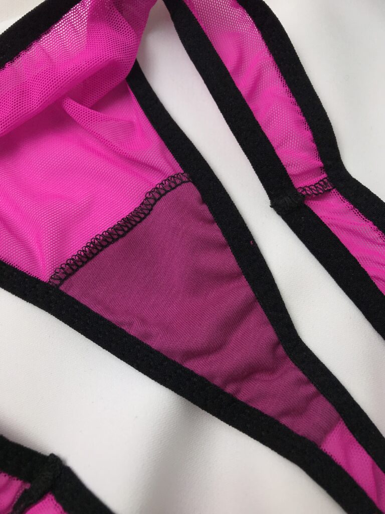 Close-up of pink thong panties showing gusset and crotch seam construction for classic lingerie sewing pattern tutorial.