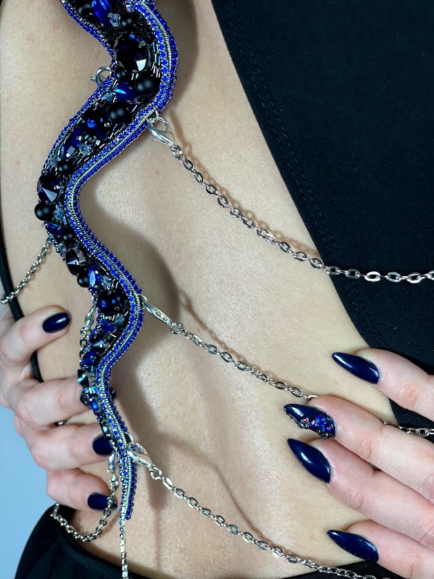 Close-up of decorative beaded felt trim on skin, showing texture and versatility of felt in fashion and embellishment projects