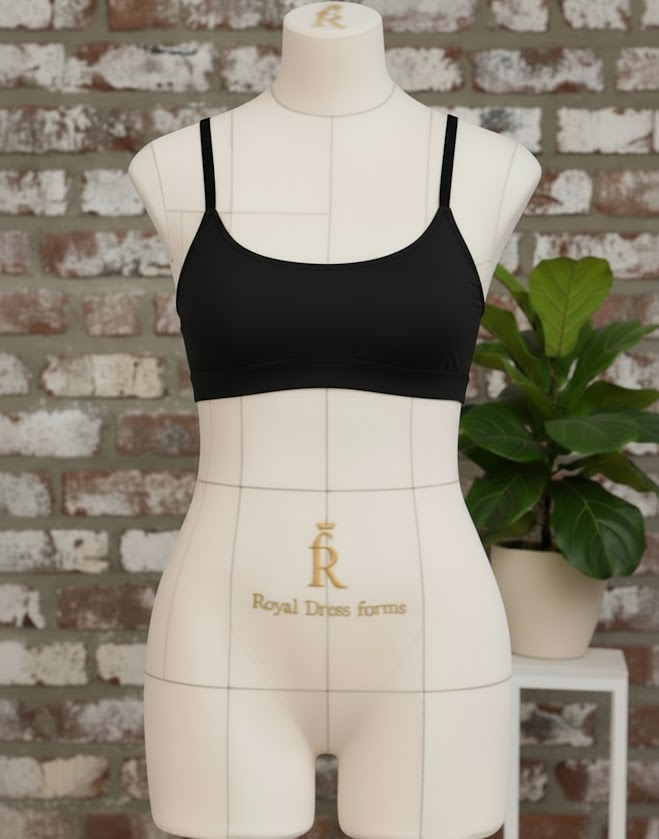 Black handmade Top-Bra “Sport” displayed on a dress form against a brick wall, sewn using the double-layer support method.