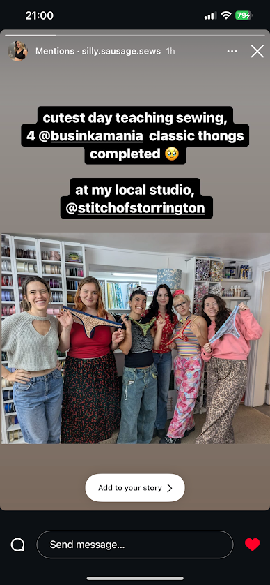 Happy group of women at sewing studio completing handmade lingerie, building community through creativity.