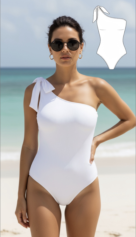 Woman wearing white one-shoulder swimsuit with bow detail on beach, showcasing handmade swimwear design and sewing pattern sketch