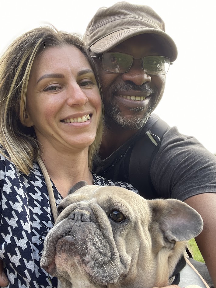 Woman, husband, and dog smiling after deciding to turn a struggling handmade hobby into a serious craft business