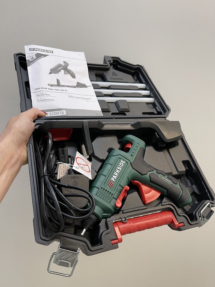 Large cordless glue gun set in case with charger and thick glue sticks, suitable for garage projects rather than small craft work