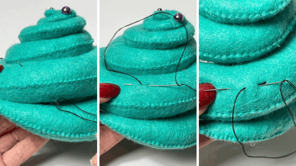 Needle working only in top layer of felt while forming chain stitch, thread passing under surface without going into stuffing