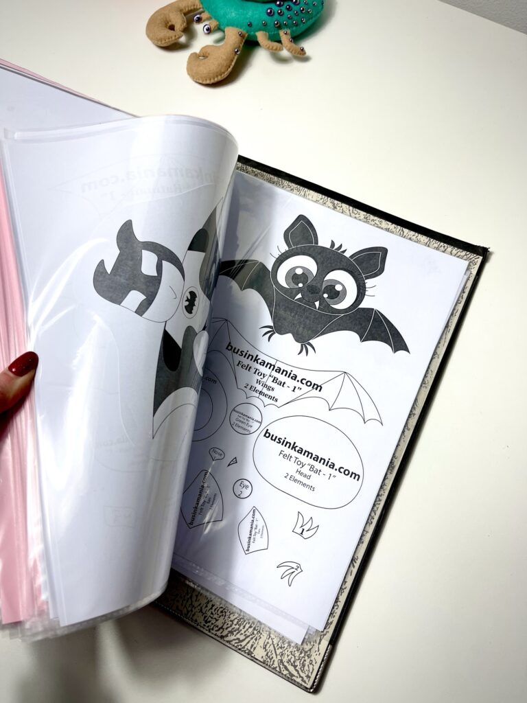 Pocket folder with printed felt sewing patterns stored in clear sleeves for organised craft pattern keeping