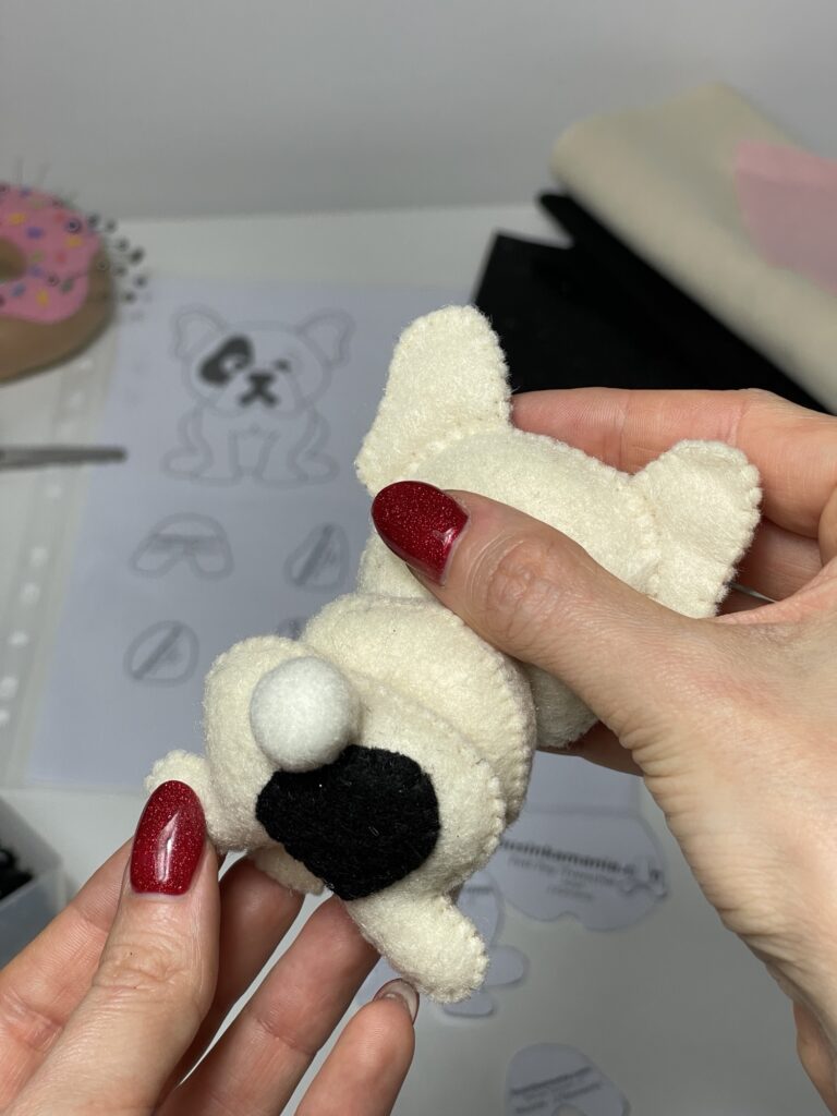 Adding small stuffed tail to felt French bulldog plushie, improving balance so handmade toy can sit upright